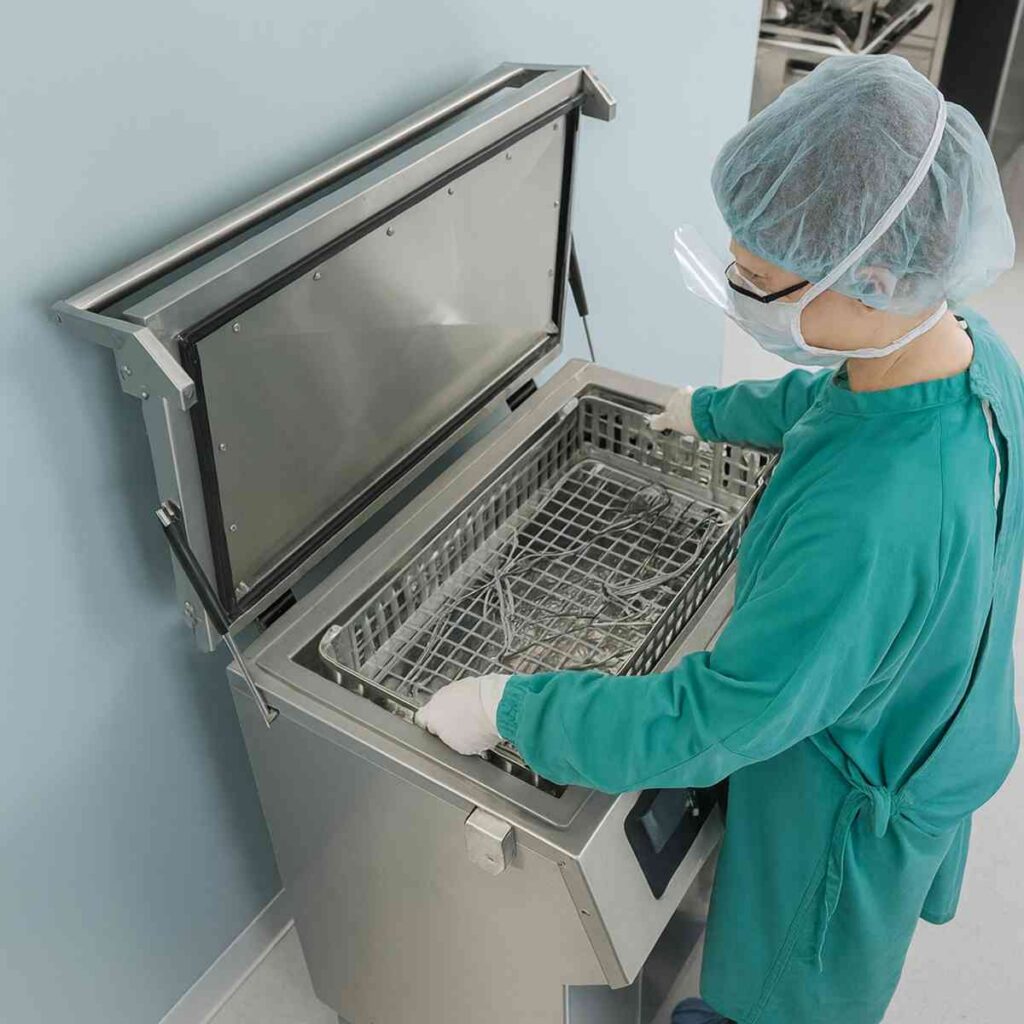 Technician using specialized cleaning equipment to decontaminate tools and materials in a controlled environment – Paul Davis Restoration Idaho Falls ID.
